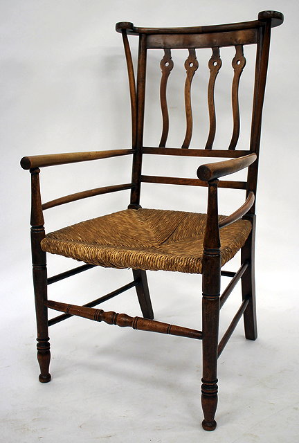 Appraisal: AN ARTS AND CRAFTS MAHOGANY AND BEECH ELBOW CHAIR the