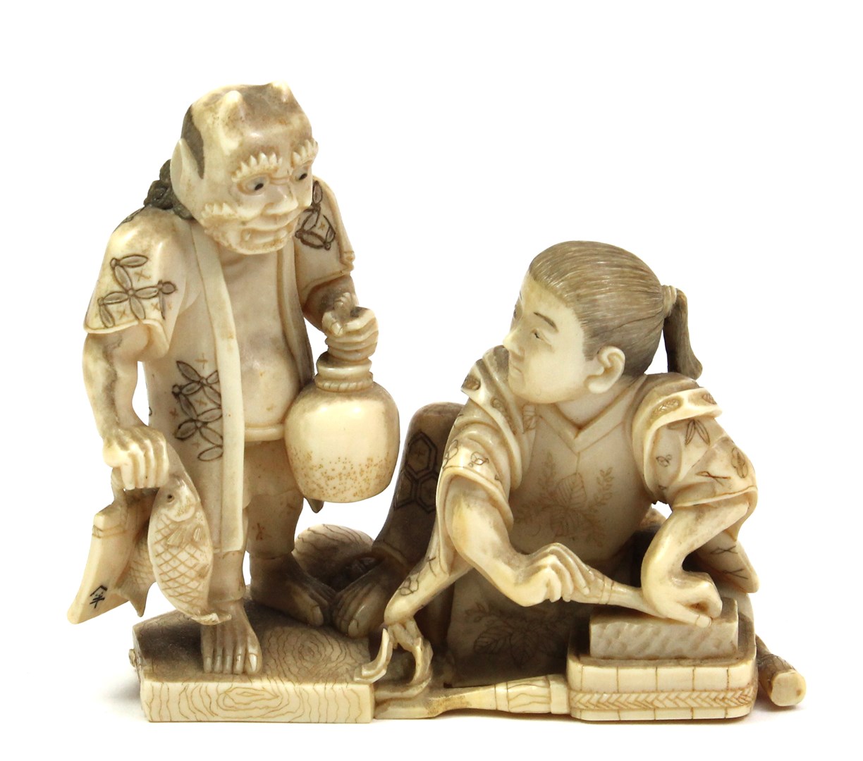 Appraisal: A Japanese ivory okimono Meiji period depicting a seated craftsman