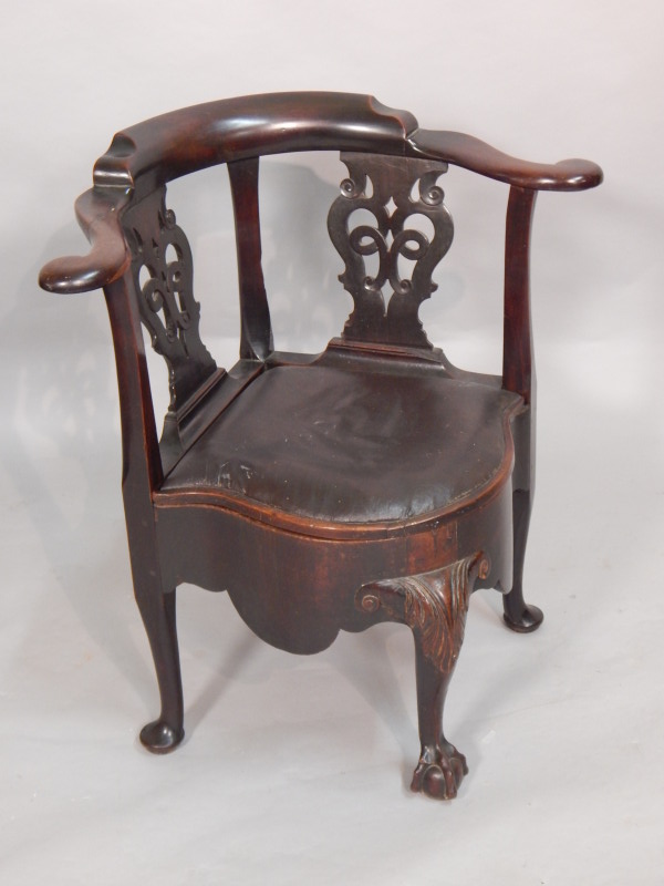 Appraisal: A George III mahogany corner commode chair with two pierced