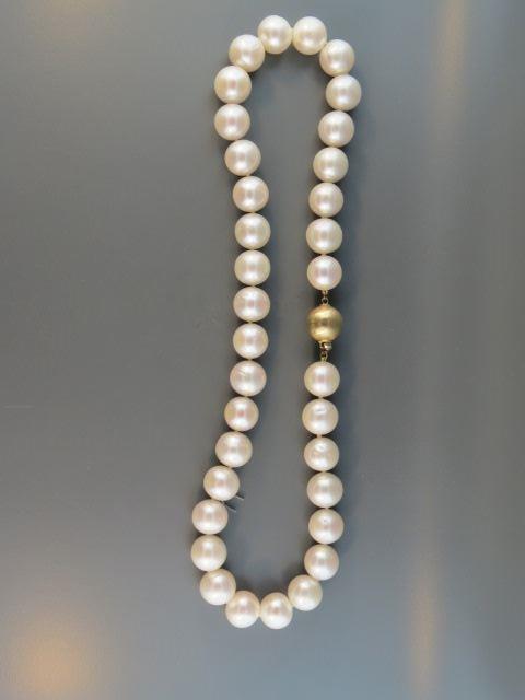 Appraisal: Pearl Necklace lusterous mm pearls k yellow gold clasp long