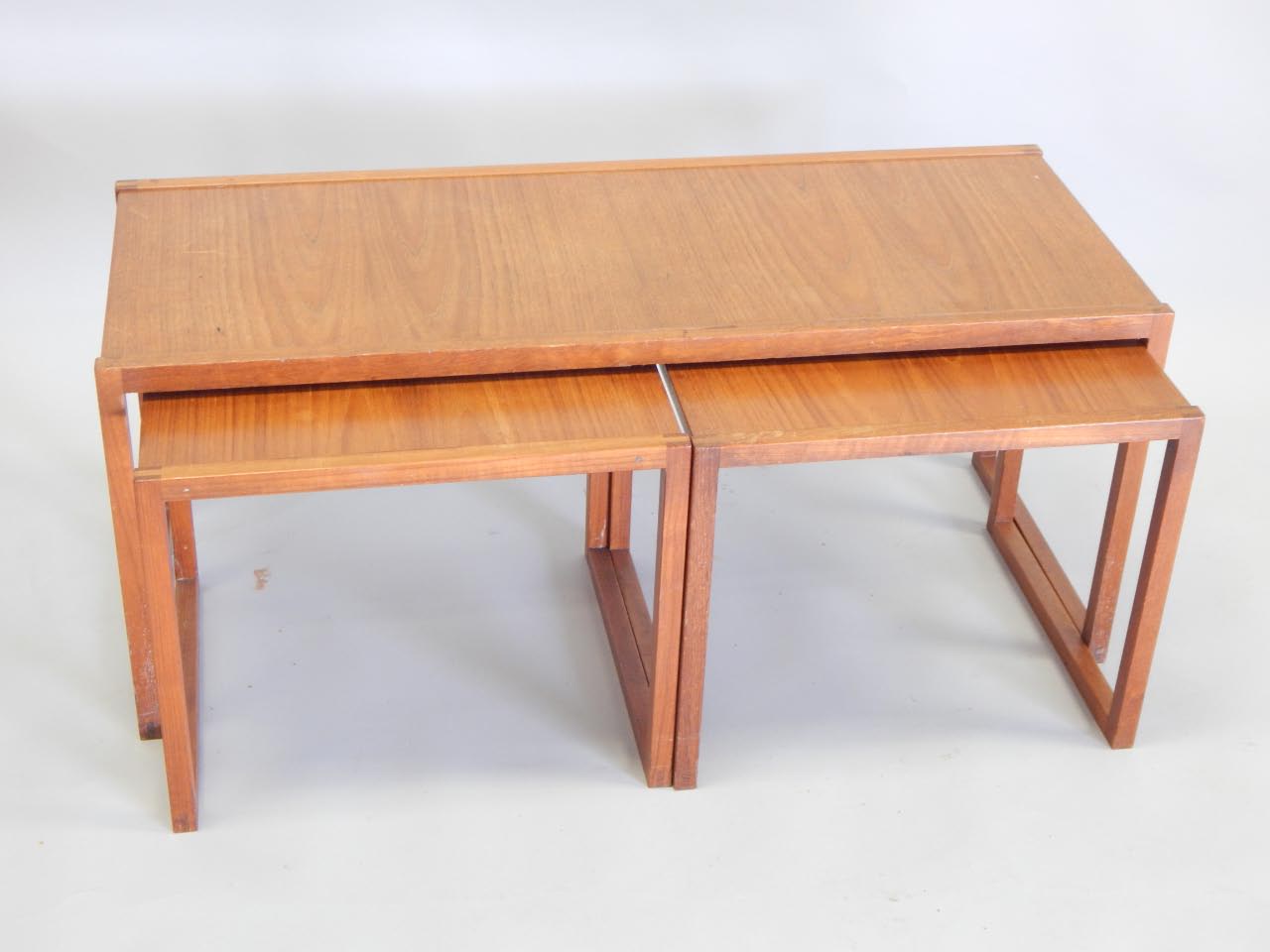 Appraisal: A nest of three teak Retro style coffee tables in