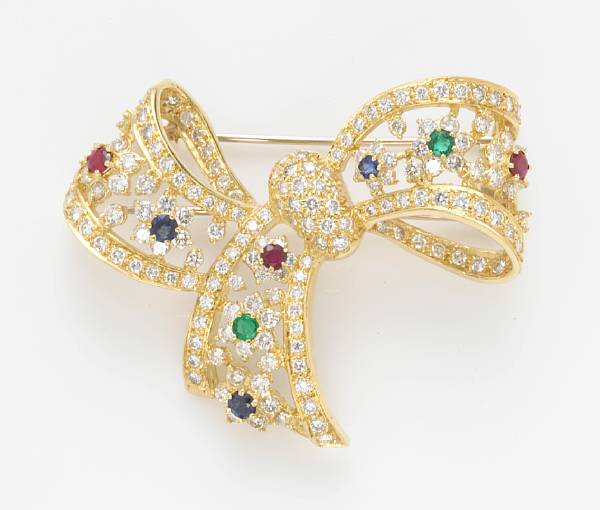 Appraisal: A sapphire emerald ruby and diamond brooch estimated total diamond