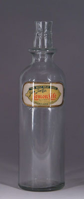 Appraisal: ANTIQUE LEMON LIFE SYRUP BOTTLE Great reverse-painted glass label on