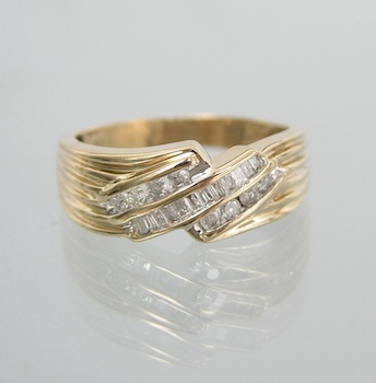 Appraisal: A Gentleman's Diamond Ring k yellow gold ring with reeded