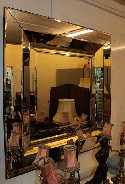 Appraisal: A LARGE CONTEMPORARY SQUARE WALL MIRROR of mirrored frame wide