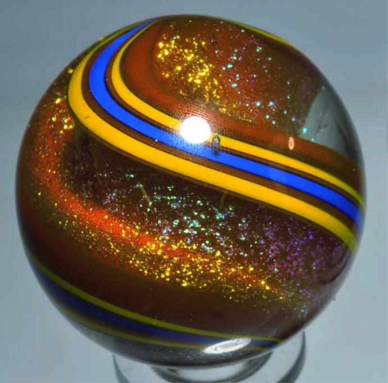 Appraisal: Geoffrey Beetem Marble Description Stardust clambroth red blue and yellow