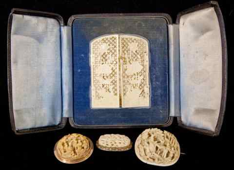 Appraisal: CHINESE EXPORT IVORY PICTURE FRAME AND THREE BROOCHES the delicate