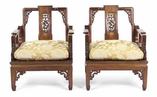 Appraisal: A Pair of Chinese Carved Hardwood Armchairs having a shaped