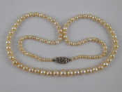 Appraisal: A graduated cultured pearl necklace pearls between approx - mm