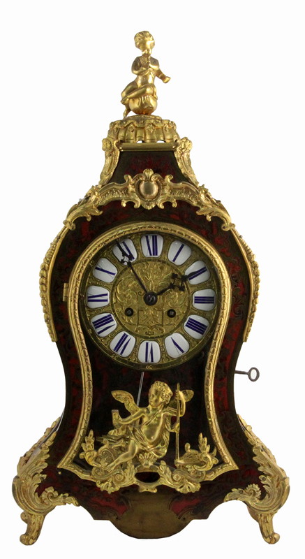 Appraisal: A Boullework and gilt metal cased mantel clock the case