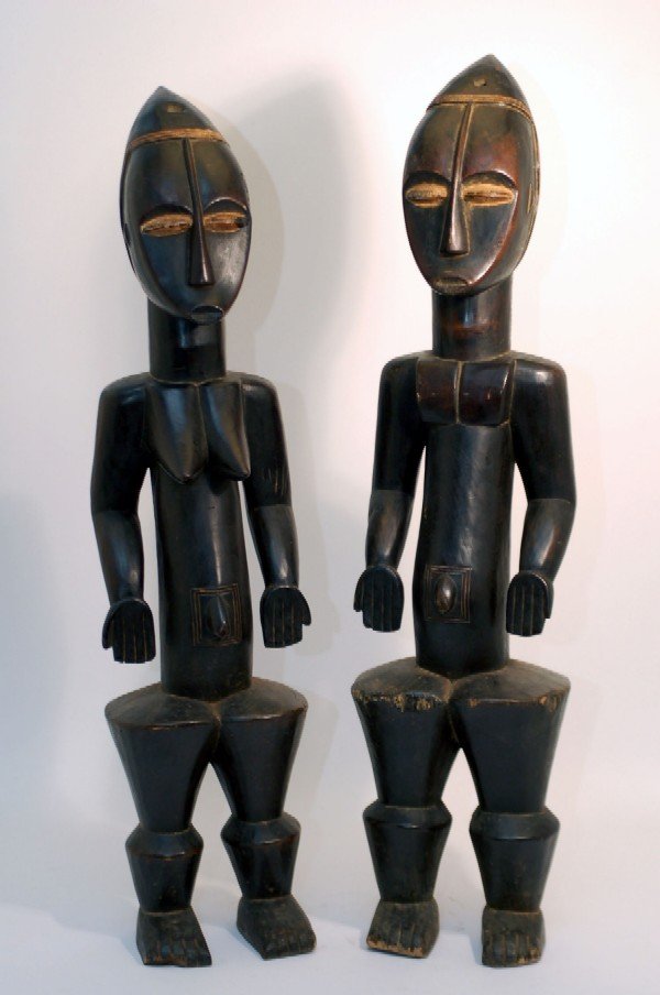 Appraisal: Lagoon area Ivory Coast male and female figures of wood