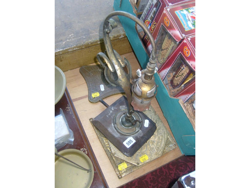 Appraisal: An Art Nouveau brass counter top gas light of scrolled