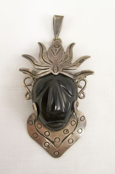 Appraisal: Sterling Tribal Warrior Face Pendant Black Obsidian glass carved pendant