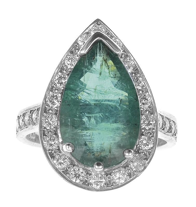 Appraisal: AN EMERALD AND DIAMOND RING Centrally set with a pear