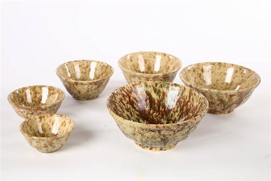 Appraisal: SIX YELLOWWARE NESTING BOWLS Graduated bowls with green brown and