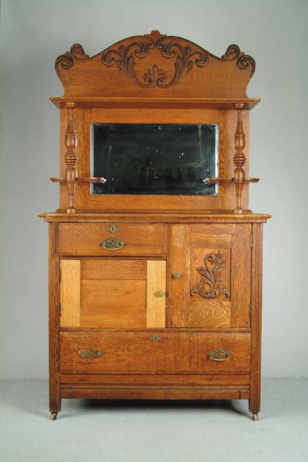 Appraisal: THREE PART OAK SIDEBOARD Decorative carved crest Bottom section has