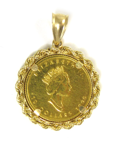 Appraisal: GOLD COIN AND FOURTEEN KARAT GOLD PENDANT featuring a Canadian