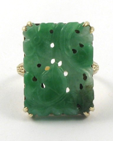 Appraisal: CARVED JADE AND FOURTEEN KARAT GOLD RING the rectangular carved