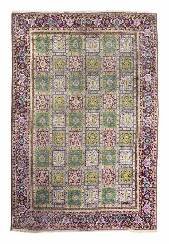 Appraisal: A Persian Wool Garden Carpet having a field decorated with