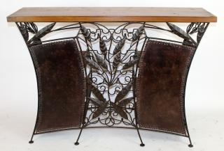 Appraisal: Iron and leather front bar with wine rack and foliate