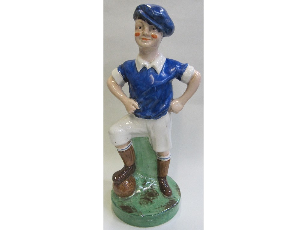 Appraisal: Britannia Pottery figure of a football player wearing a blue