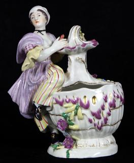 Appraisal: Hochst porcelain figural sweetmeat dish Hochst polychrome decorated porcelain figural