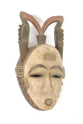 Appraisal: A Nigerian mask with twin bird headdress and white green