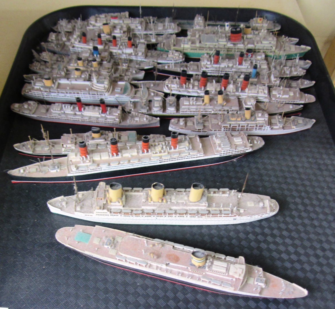 Appraisal: A quantity of miniature painted wooden model ships th century