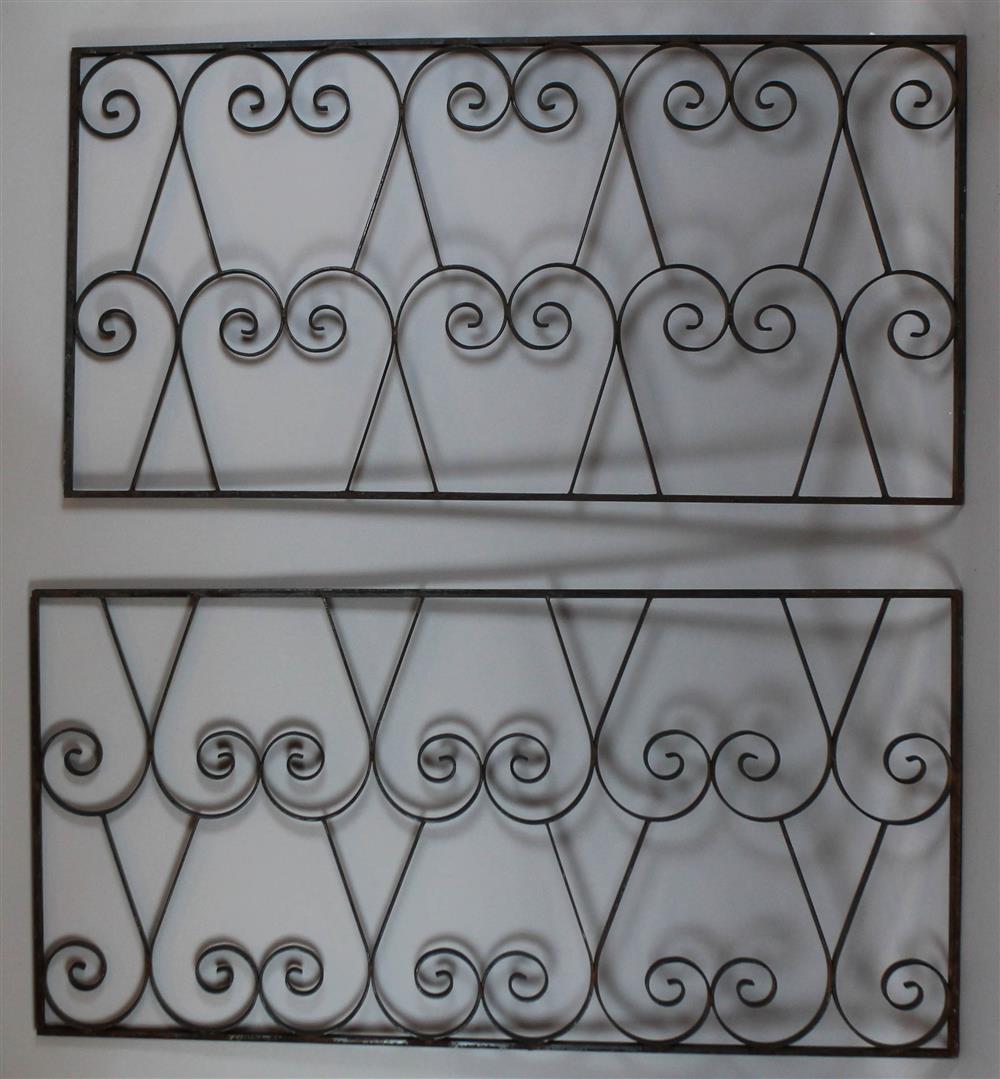 Appraisal: TWO SIMILAR VINTAGE DECORATIVE SCROLLING IRON RAILINGS the larger is