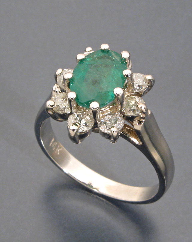 Appraisal: EMERALD DIAMOND AND FOURTEEN KARAT WHITE GOLD RING with eight