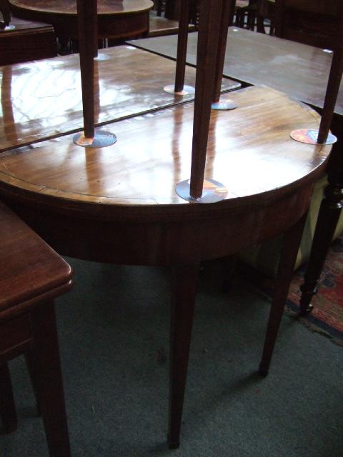 Appraisal: A George III mahogany fold over card table the demi