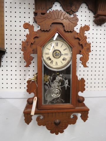 Appraisal: Ansonia Hanging Gingerbread Wall Clock walnut carved case -day movement