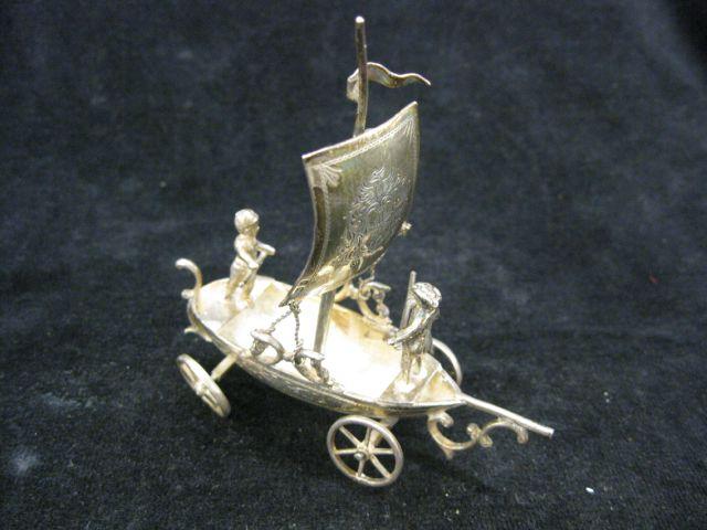 Appraisal: English Sterling Silver Miniature of Figures on ship with wheels