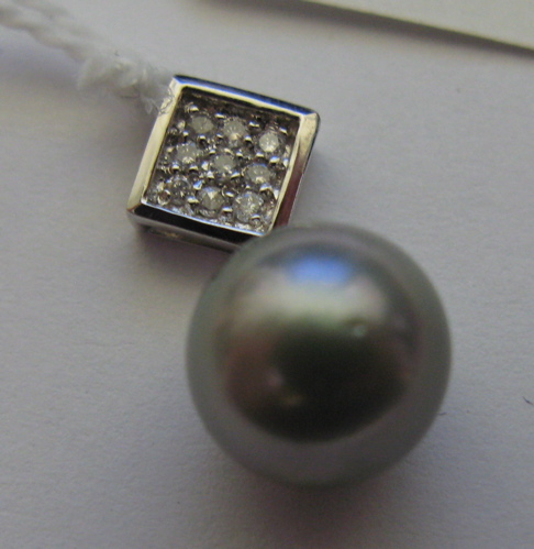 Appraisal: BLACK PEARL DIAMOND AND FOURTEEN KARAT WHITE GOLD PENDANT with