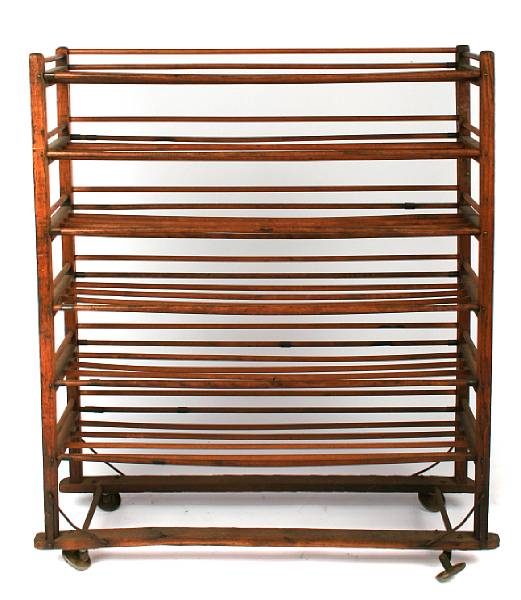 Appraisal: A pine drying rack together with a copper hanging pot