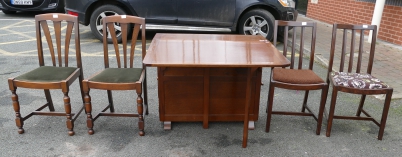 Appraisal: Oak drop leaf table and four similar un-matching chairs