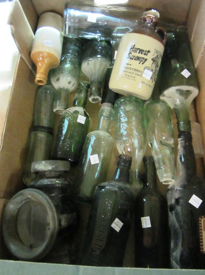 Appraisal: A quantity of glass and stoneware drinks bottles with local