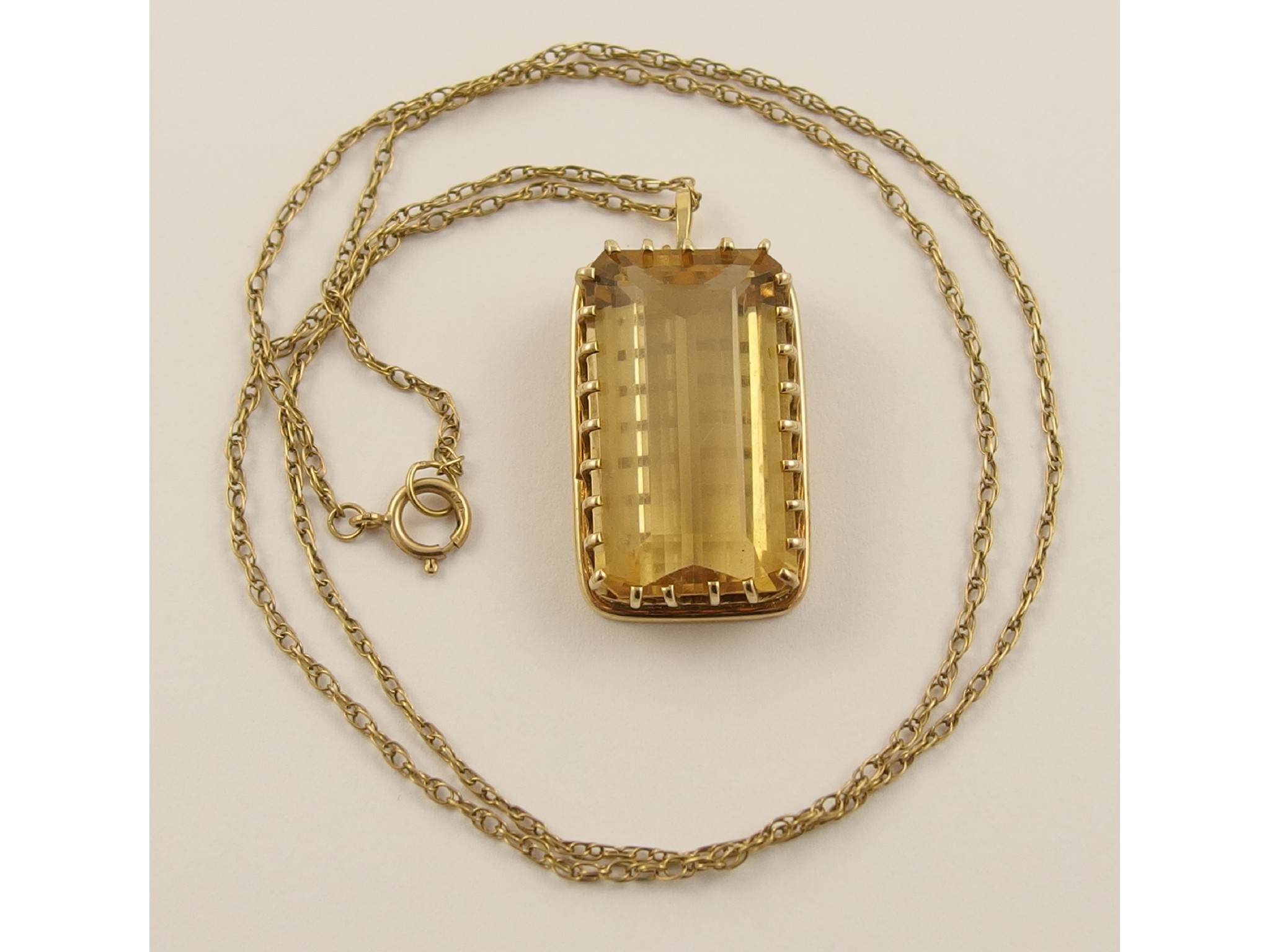 Appraisal: An ct pendant set with a large emerald cut citrine