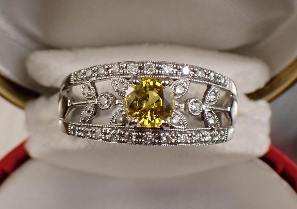 Appraisal: YELLOW SAPPHIRE DIAMOND AND FOURTEEN KARAT GOLD RING The pieced