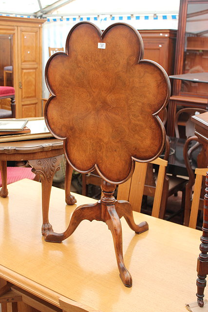 Appraisal: A REPRODUCTION BURR WALNUT TILT TOP TRIPOD TABLE a late