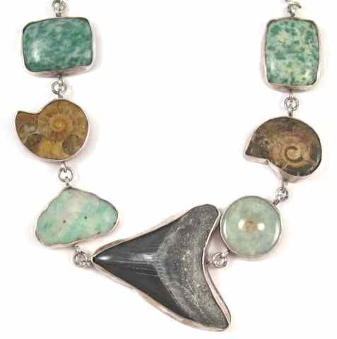 Appraisal: GREEN JADE FOUR SEGMENTS AND SHAPED FOSSILS in sterling silver