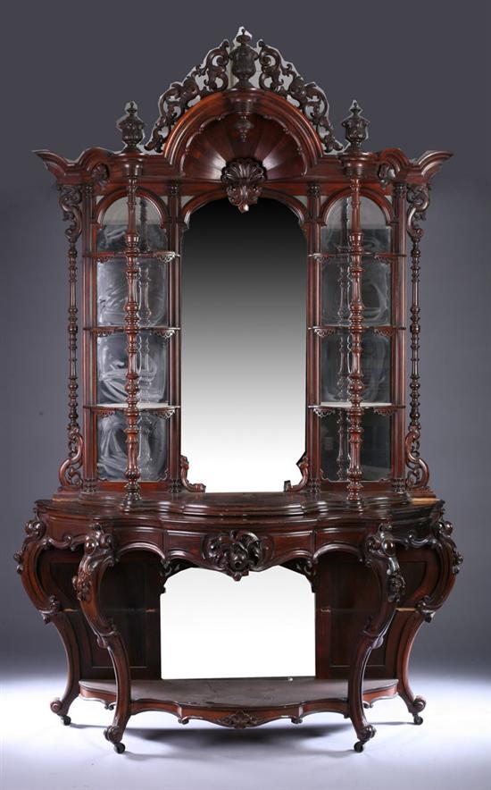 Appraisal: VICTORIAN ELABORATELY CARVED MAHOGANY MIRRORED-BACK CONSOLE ETAGERE in the modified