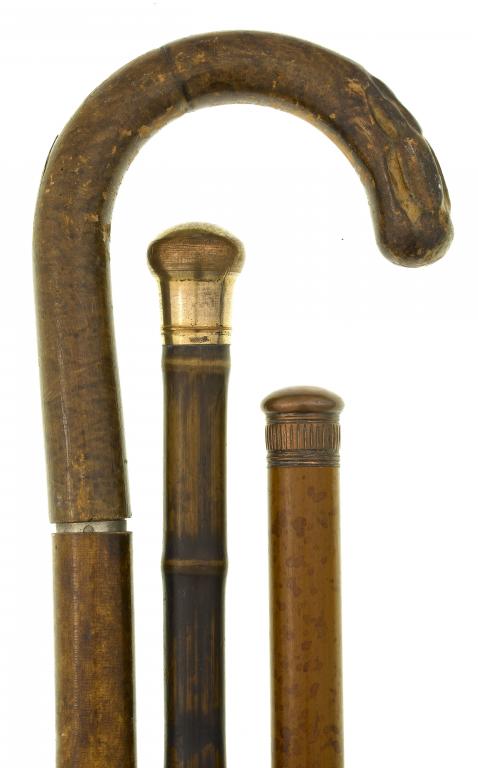 Appraisal: A TIPPLER'S GADGET CANE of attractively mottled light wood with