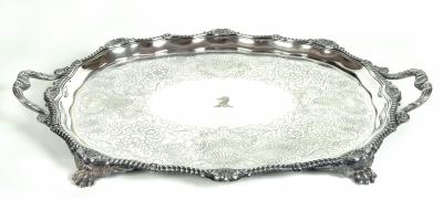 Appraisal: AN EDWARDIAN TEA TRAY of shaped oval form with gadroon