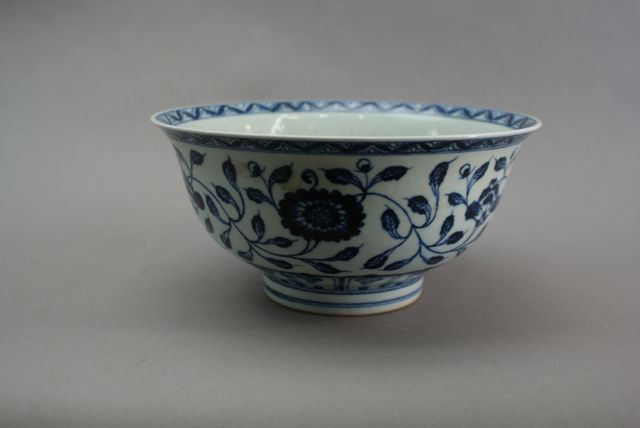 Appraisal: A Chinese blue and white bowl with incised floral scrolls