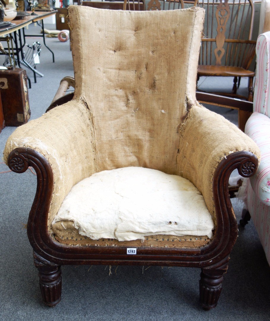 Appraisal: An early th century mahogany framed armchair with reeded decoration