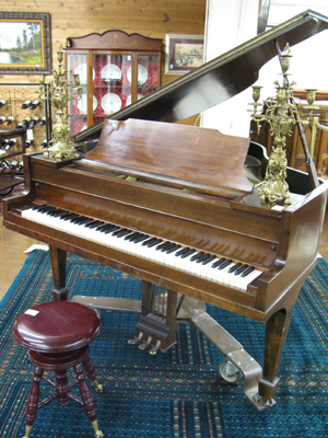 Appraisal: A MAHOGANY BABY GRAND PIANO Wurlitzer Piano Co Dekalb Illinois