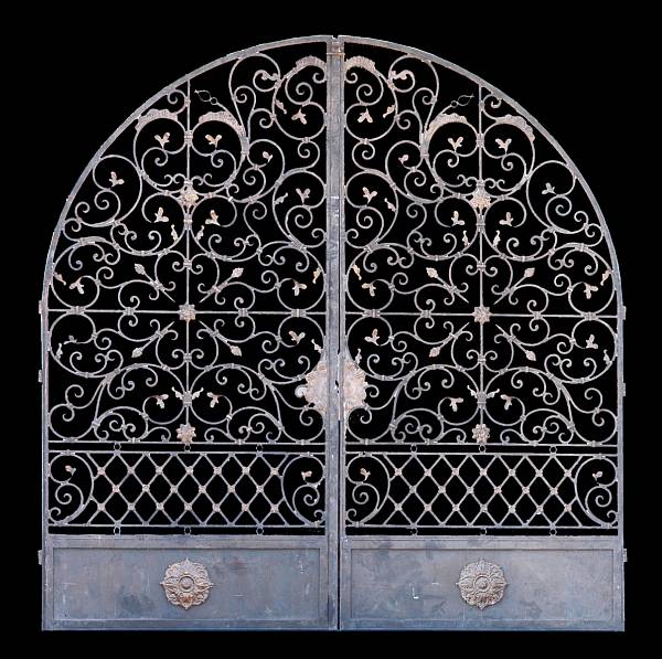 Appraisal: A pair of wrought iron and tole gates modern Each