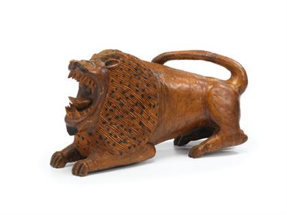 Appraisal: UNKNOWN fourth quarter of th century Two carved wooden lions