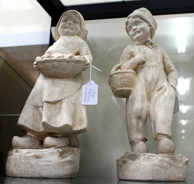 Appraisal: A PAIR OF PLASTER FIGURES one of a Dutch boy